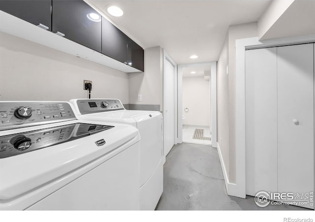 laundry room featuring independent washer and dryer, cabinet space, and recessed lighting