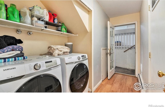 879-881 19th St, Boulder, CO 80302 - clothes washing area featuring washing machine and clothes dryer, light wood finished floors, and baseboards