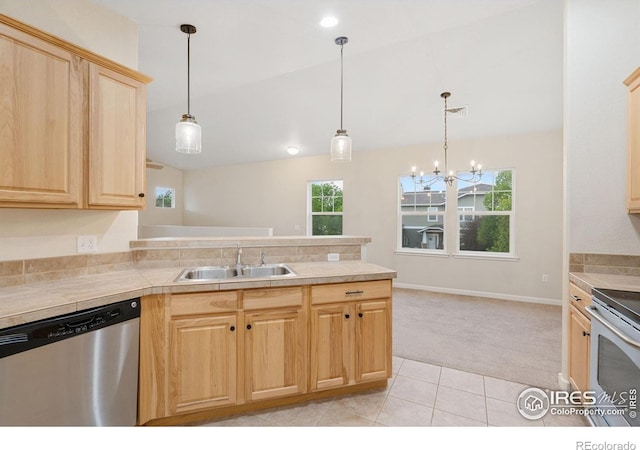 2502 Owens Ave Unit 201, Fort Collins, CO 80528 - kitchen with appliances with stainless steel finishes, light brown cabinetry, light colored carpet, a sink, and a peninsula