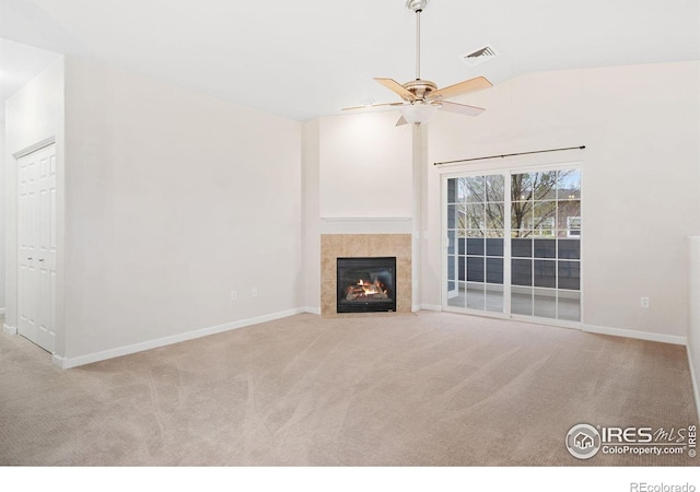 2502 Owens Ave Unit 201, Fort Collins, CO 80528 - unfurnished living room with vaulted ceiling, carpet, ceiling fan, a fireplace, and baseboards