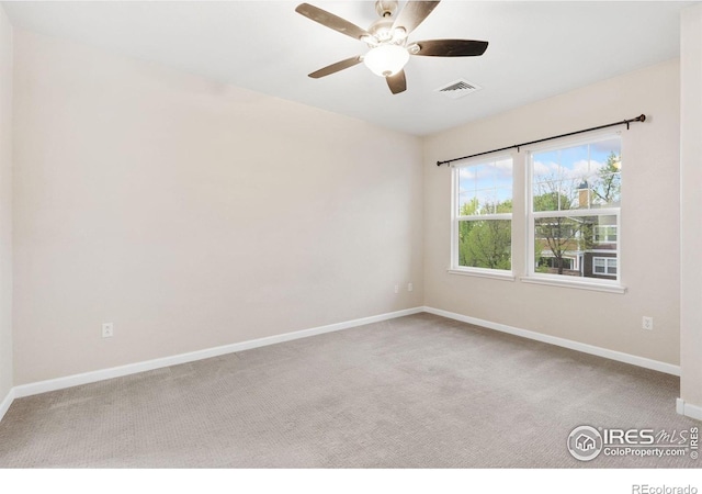 2502 Owens Ave Unit 201, Fort Collins, CO 80528 - empty room featuring carpet floors, baseboards, and a ceiling fan