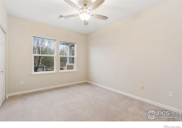 2502 Owens Ave Unit 201, Fort Collins, CO 80528 - spare room featuring light carpet, baseboards, and ceiling fan
