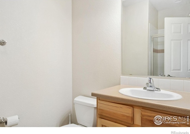 2502 Owens Ave Unit 201, Fort Collins, CO 80528 - full bath featuring toilet, vanity, and a shower with door