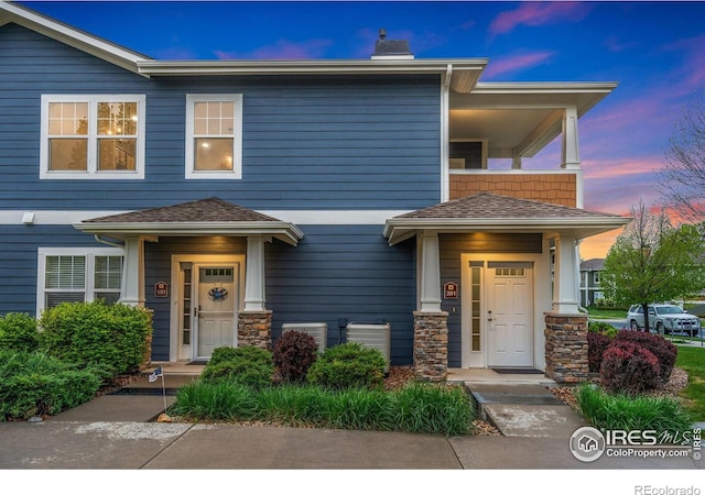 2502 Owens Ave Unit 201, Fort Collins, CO 80528 - view of front of home with a chimney and stone siding