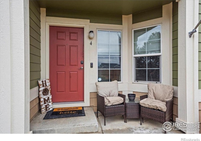 entrance to property featuring covered porch