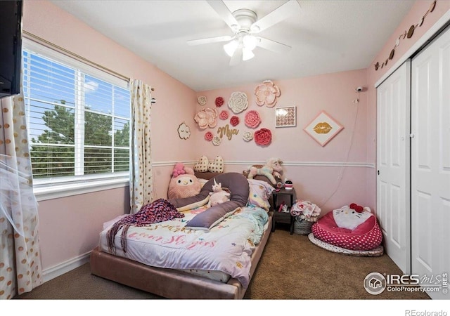 carpeted bedroom with a closet and ceiling fan