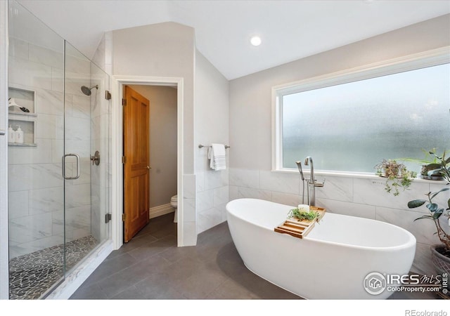 4059 Nevis St, Boulder, CO 80301 - full bathroom featuring a stall shower, a soaking tub, lofted ceiling, tile walls, and recessed lighting