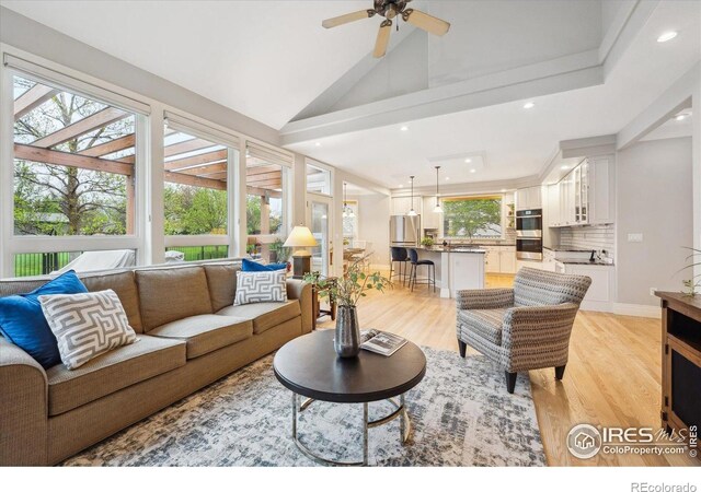 4059 Nevis St, Boulder, CO 80301 - living area with recessed lighting, light wood-type flooring, ceiling fan, and vaulted ceiling