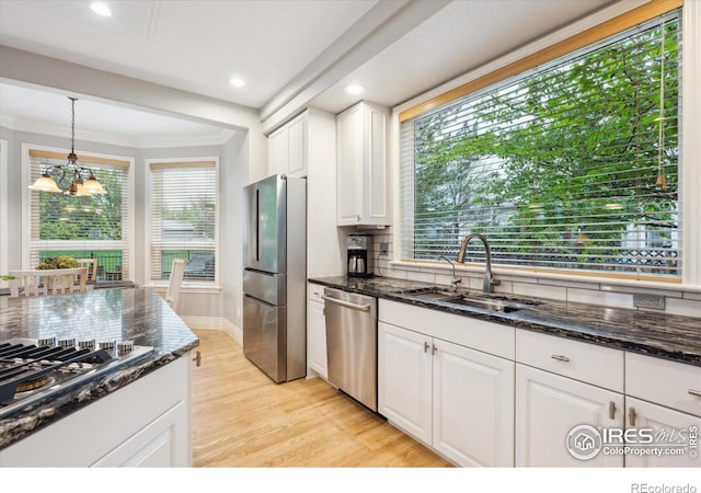 4059 Nevis St, Boulder, CO 80301 - kitchen with appliances with stainless steel finishes, tasteful backsplash, white cabinetry, recessed lighting, and ornamental molding