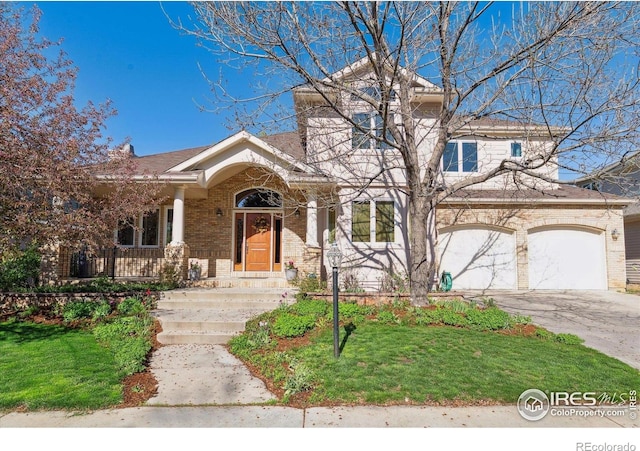 4059 Nevis St, Boulder, CO 80301 - view of front of home featuring brick siding, concrete driveway, a front lawn, and an attached garage