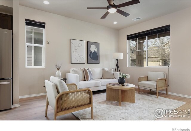 living room with ceiling fan, light wood-type flooring, baseboards, and recessed lighting