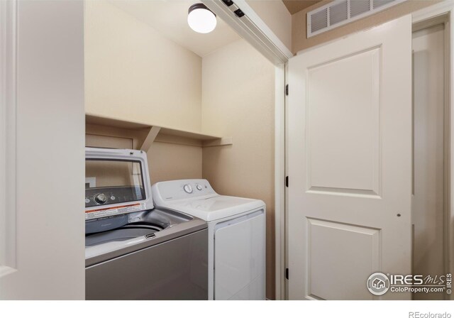 laundry area featuring washer and clothes dryer