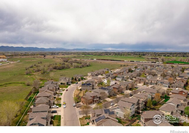 aerial view of residential area featuring a mountain backdrop