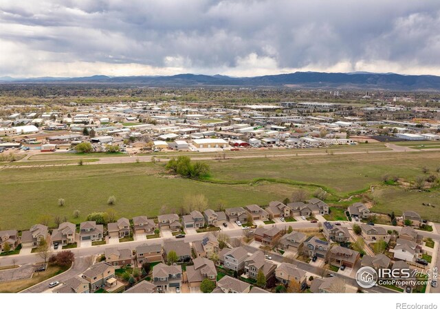 view of property location with nearby suburban area and a mountain backdrop