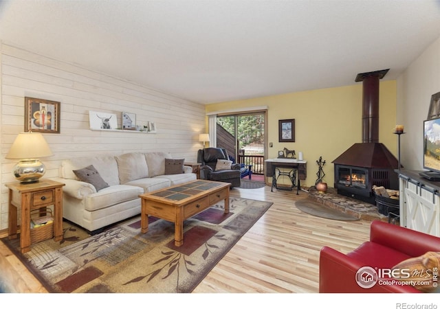 620 Macgregor Ave Unit 2, Estes Park, CO 80517 - living room with wood finished floors, wood walls, and a wood stove
