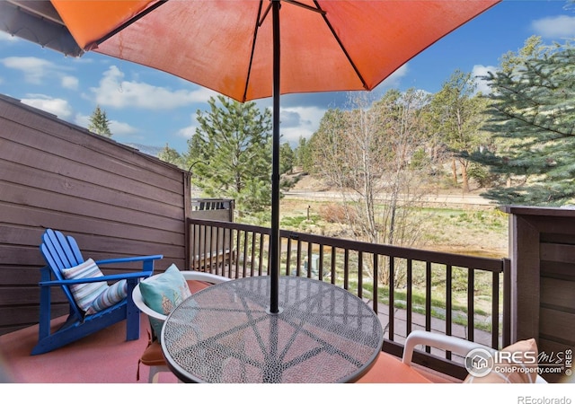 620 Macgregor Ave Unit 2, Estes Park, CO 80517 - wooden terrace with outdoor dining area