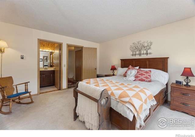 620 Macgregor Ave Unit 2, Estes Park, CO 80517 - bedroom featuring light colored carpet and ensuite bath