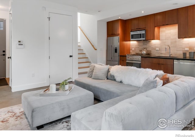 1838 22nd St, Boulder, CO 80302 - living room featuring stairway, baseboards, recessed lighting, and concrete floors