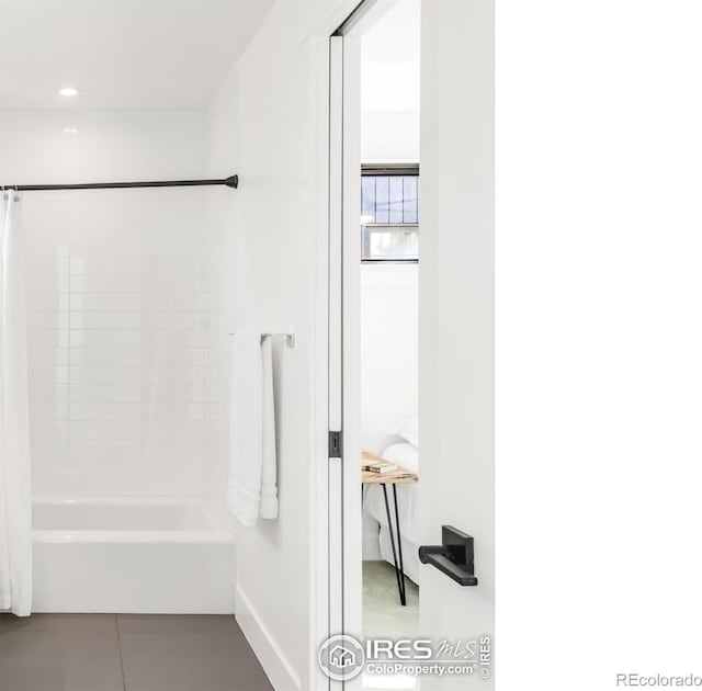 1838 22nd St, Boulder, CO 80302 - bathroom with tile patterned floors, baseboards, and shower / bathtub combination with curtain