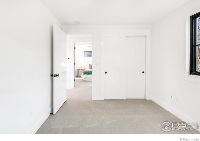 1838 22nd St, Boulder, CO 80302 - unfurnished bedroom featuring carpet floors, a closet, and baseboards