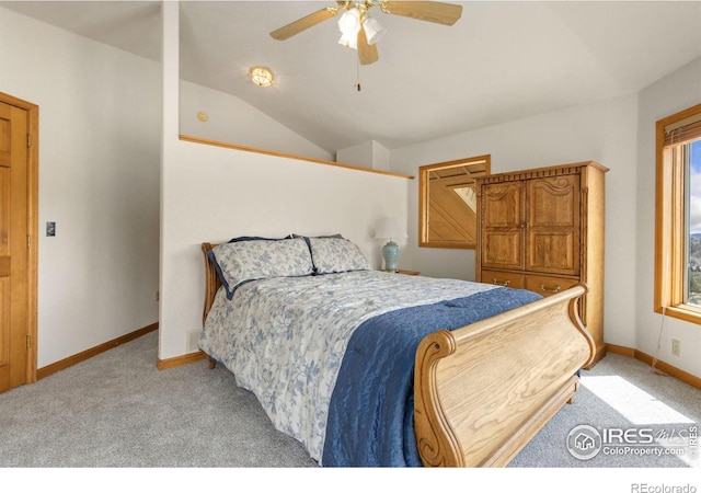 331 Laplata Dr, Livermore, CO 80536 - bedroom featuring light carpet, vaulted ceiling, baseboards, and ceiling fan
