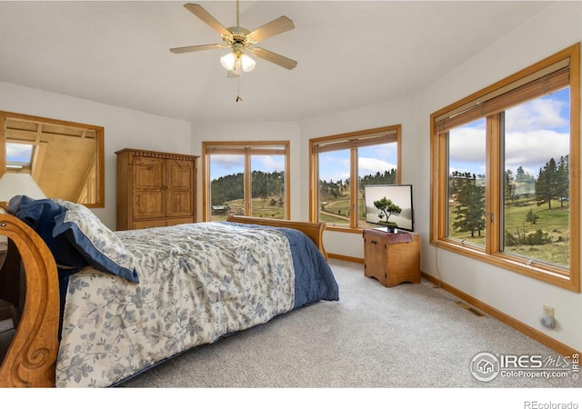 331 Laplata Dr, Livermore, CO 80536 - bedroom featuring baseboards, light carpet, and ceiling fan