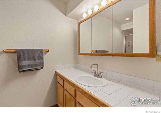331 Laplata Dr, Livermore, CO 80536 - bathroom with vanity and a stall shower