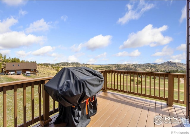 331 Laplata Dr, Livermore, CO 80536 - wooden terrace featuring a mountain view and a lawn