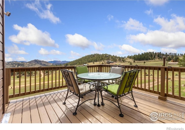 331 Laplata Dr, Livermore, CO 80536 - deck featuring outdoor dining space and a mountain view