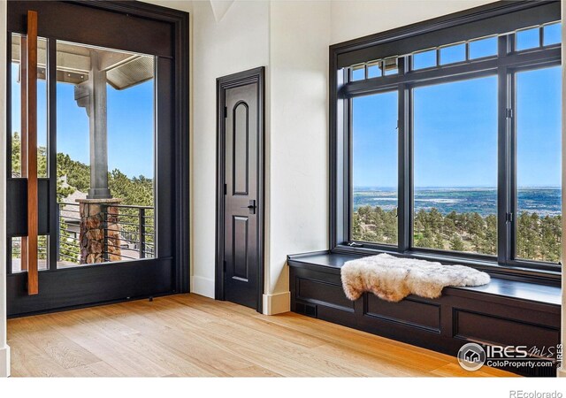 sitting room featuring wood finished floors and baseboards