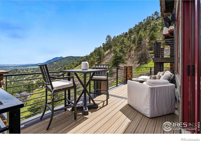 wooden deck featuring a mountain view