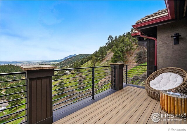 wooden deck with a mountain view