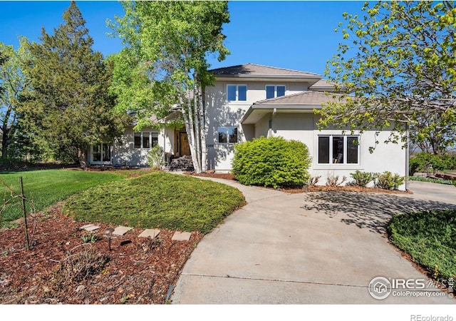 7309 Didrickson Ct, Fort Collins, CO 80528 - traditional-style house featuring stucco siding and a front yard