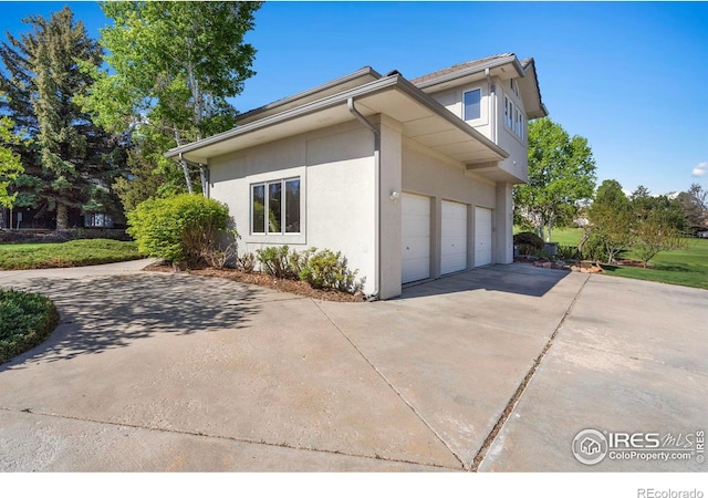 7309 Didrickson Ct, Fort Collins, CO 80528 - view of home's exterior with concrete driveway and stucco siding