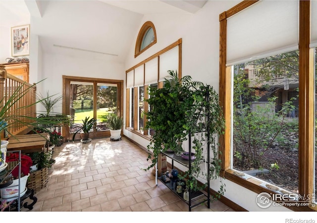 7309 Didrickson Ct, Fort Collins, CO 80528 - sunroom / solarium with vaulted ceiling, tile patterned flooring, and baseboards