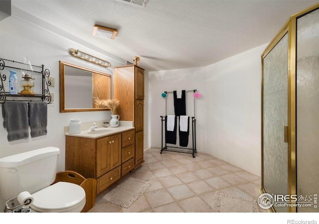 7309 Didrickson Ct, Fort Collins, CO 80528 - full bathroom featuring vanity, a shower stall, toilet, and a textured ceiling