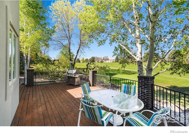 7309 Didrickson Ct, Fort Collins, CO 80528 - wooden deck featuring outdoor dining space, a grill, view of golf course, and a yard