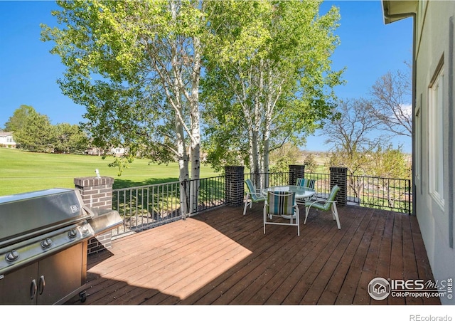 7309 Didrickson Ct, Fort Collins, CO 80528 - wooden terrace featuring outdoor dining space, grilling area, a yard, and golf course view