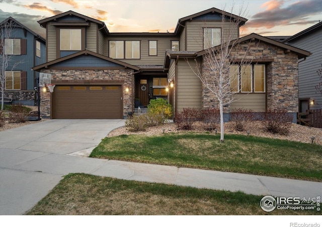 25190 E Nova Pl, Aurora, CO 80016 - view of front of property featuring stone siding, concrete driveway, and a front yard