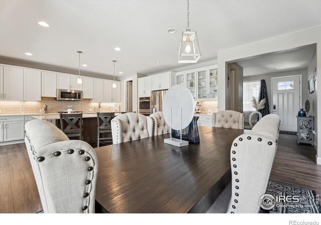 25190 E Nova Pl, Aurora, CO 80016 - dining room with wood finished floors and recessed lighting