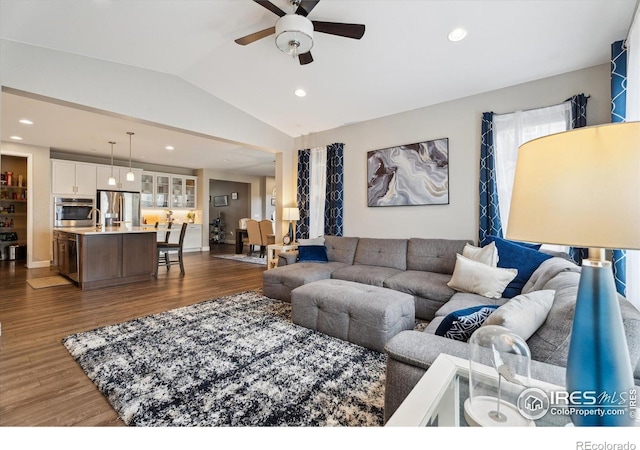 25190 E Nova Pl, Aurora, CO 80016 - living area with vaulted ceiling, a ceiling fan, dark wood-style flooring, and recessed lighting