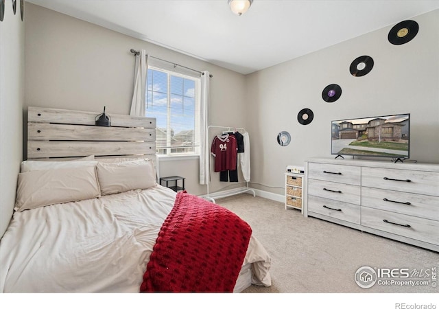25190 E Nova Pl, Aurora, CO 80016 - bedroom with light carpet and baseboards