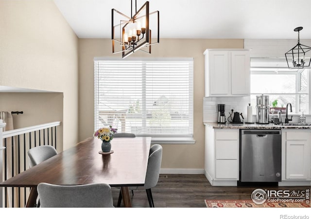 12506 Maria Cir, Broomfield, CO 80020 - dining room featuring a chandelier, dark wood-style floors, and baseboards