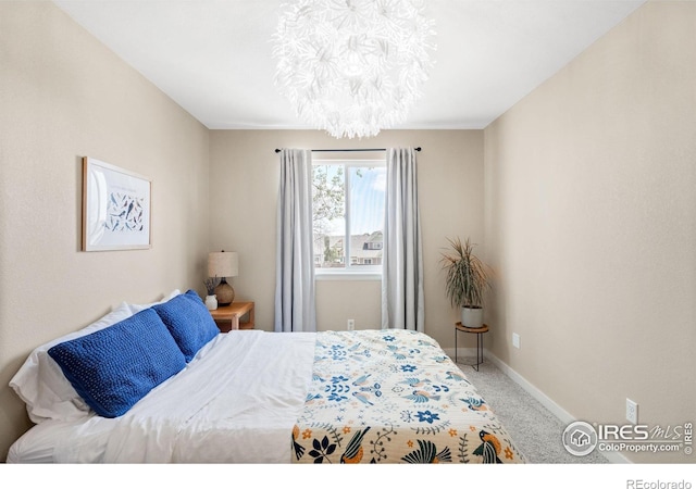 12506 Maria Cir, Broomfield, CO 80020 - bedroom featuring carpet, a chandelier, and baseboards