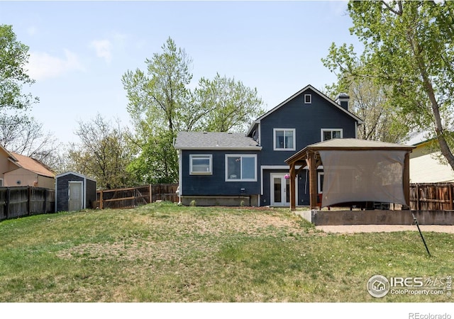 12506 Maria Cir, Broomfield, CO 80020 - rear view of house with a gazebo, a storage shed, a chimney, and an outbuilding