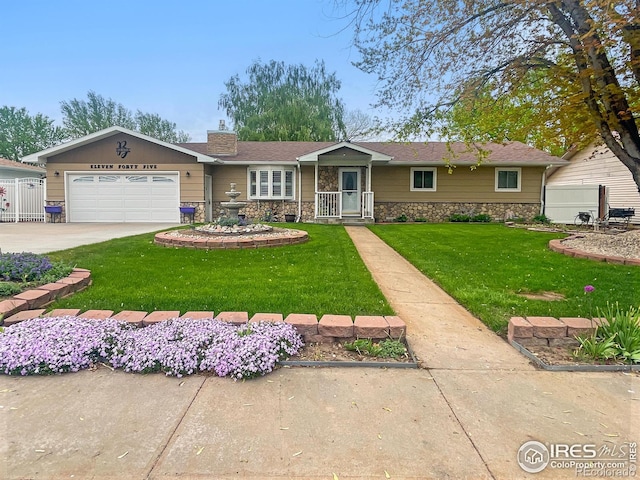 1145 S Bowman Ave, Holyoke, CO 80734 - single story home featuring stone siding, a front yard, a chimney, concrete driveway, and a garage
