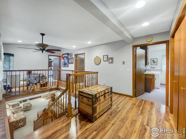 1145 S Bowman Ave, Holyoke, CO 80734 - corridor featuring an upstairs landing, wood finished floors, recessed lighting, and baseboards