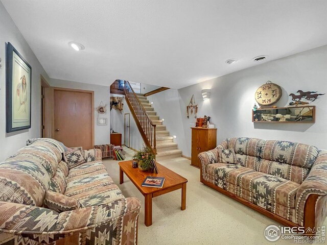 1145 S Bowman Ave, Holyoke, CO 80734 - living area featuring carpet floors, stairs, and recessed lighting