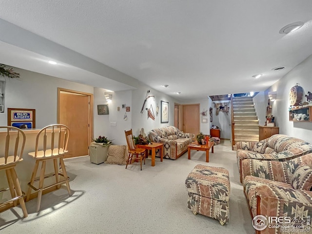 1145 S Bowman Ave, Holyoke, CO 80734 - carpeted living room featuring stairs and recessed lighting