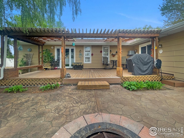 1145 S Bowman Ave, Holyoke, CO 80734 - back of property featuring a deck, a pergola, a fire pit, and a patio